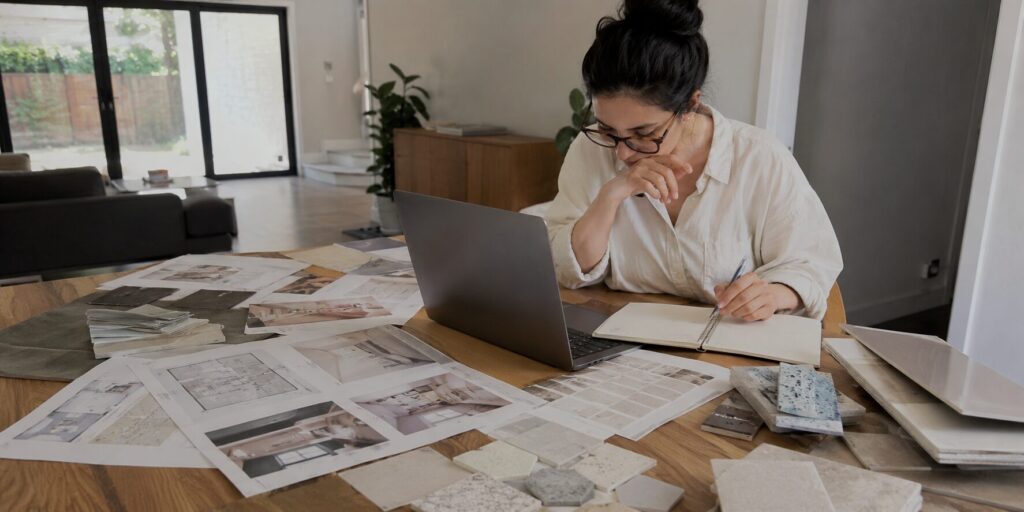 A woman busy planning for her home remodeling with ProWork Builders.